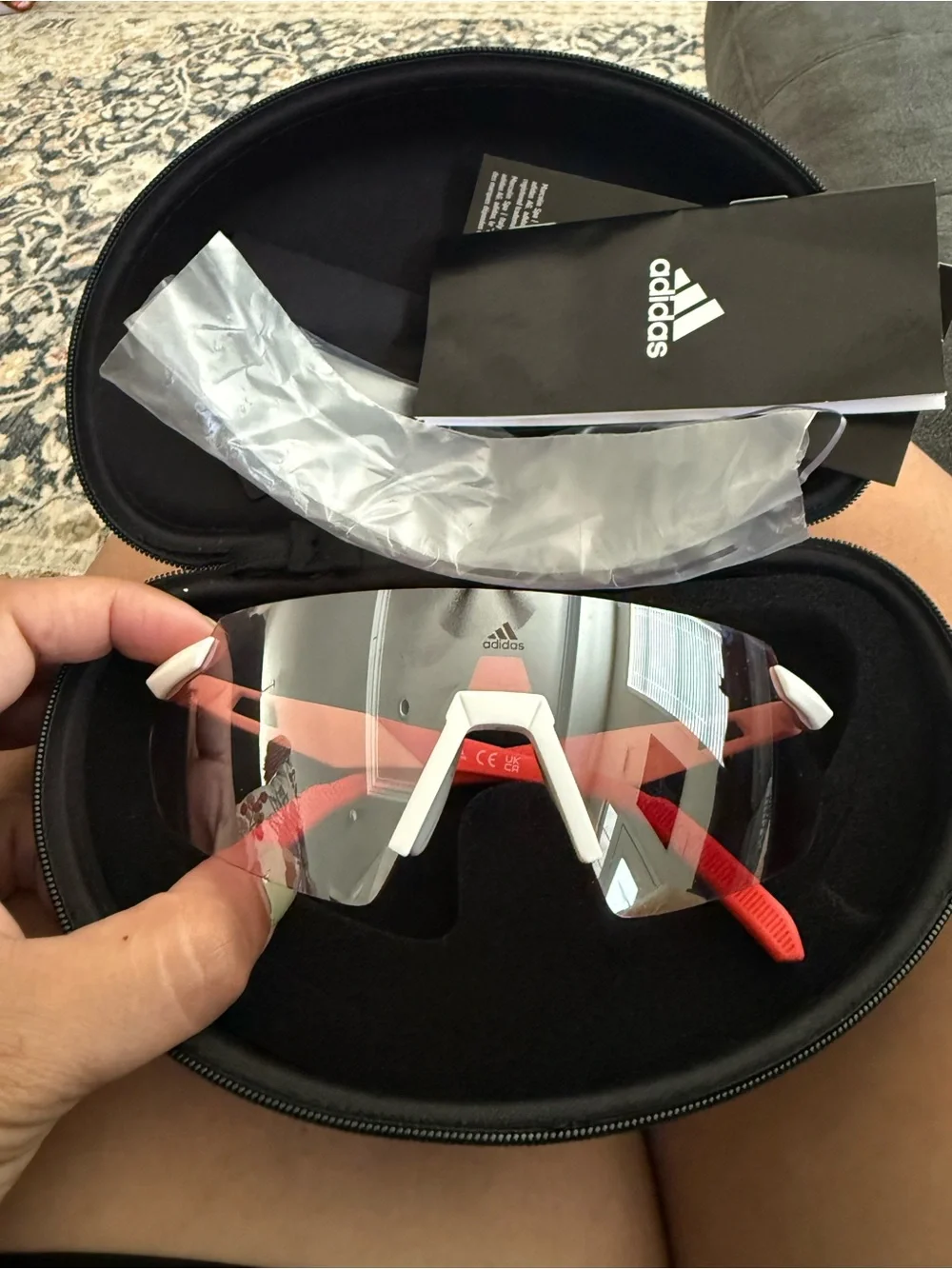 Adidas Sport SP0077 rimless shield sunglasses feature a white/red frames